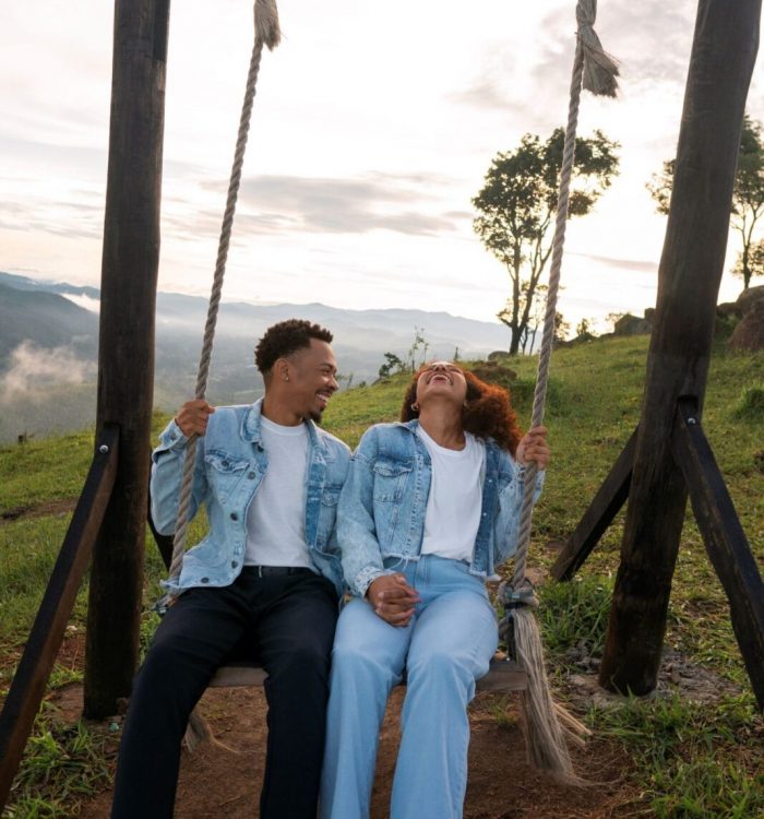 full-shot-couple-swing-outdoors-scaled.jpg