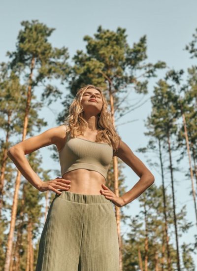 woman-practising-yoga-park-looking-involved